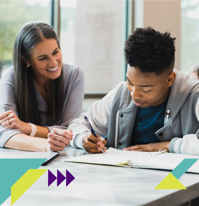 Teacher helping student