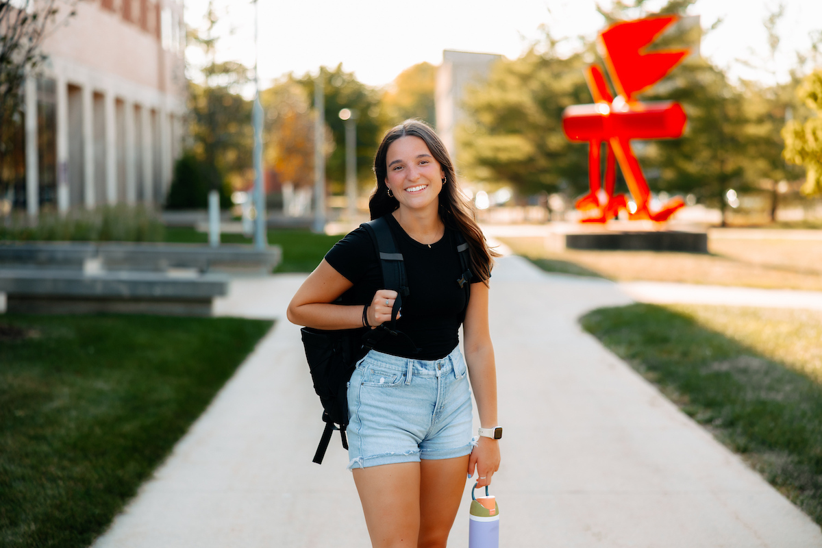 Student outside Curris Business Building