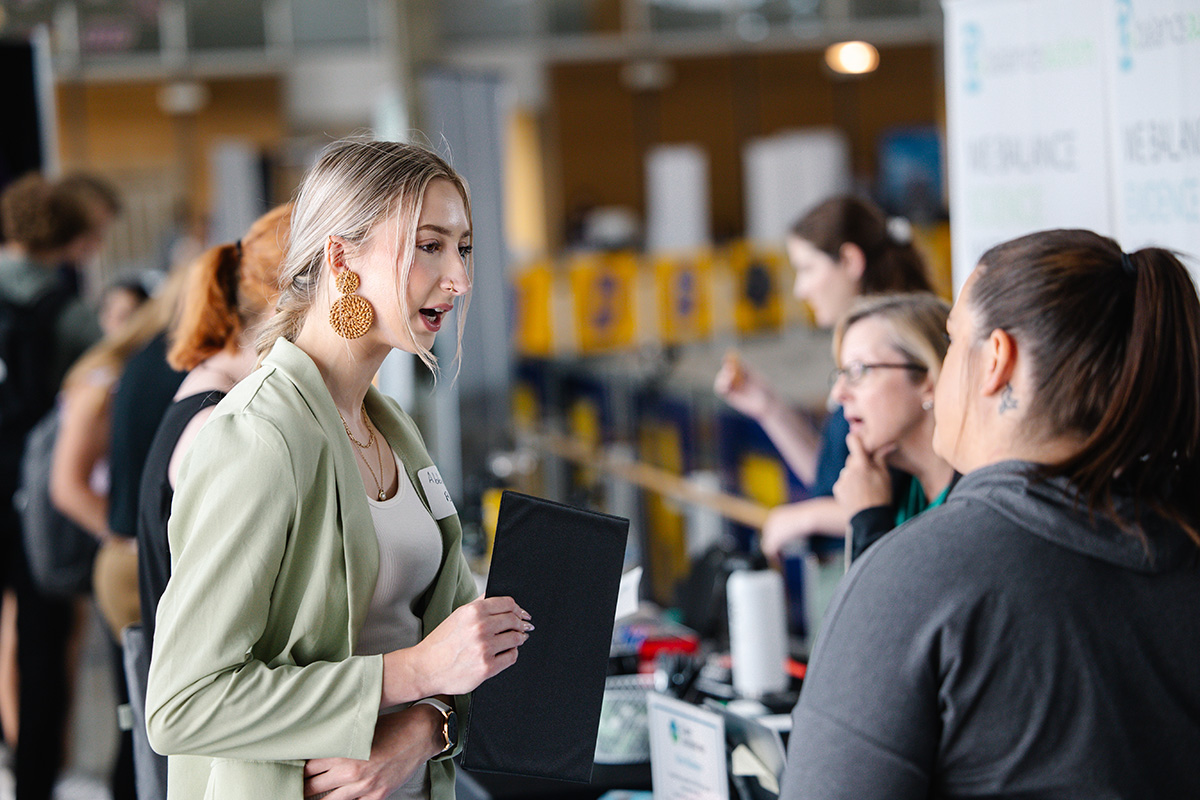 Students talk to businesses about job opportunies at the UNI career fair