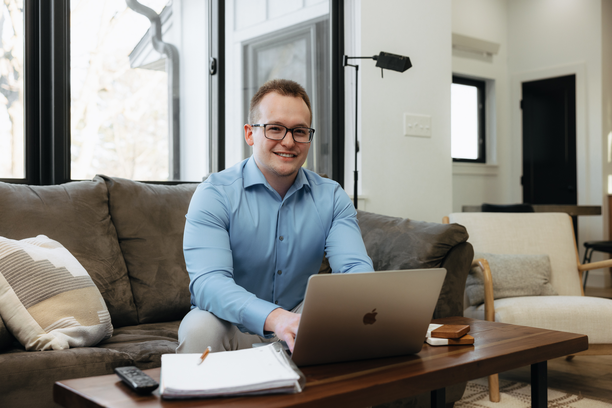 Professional student reviewing MBA requirements on laptop.