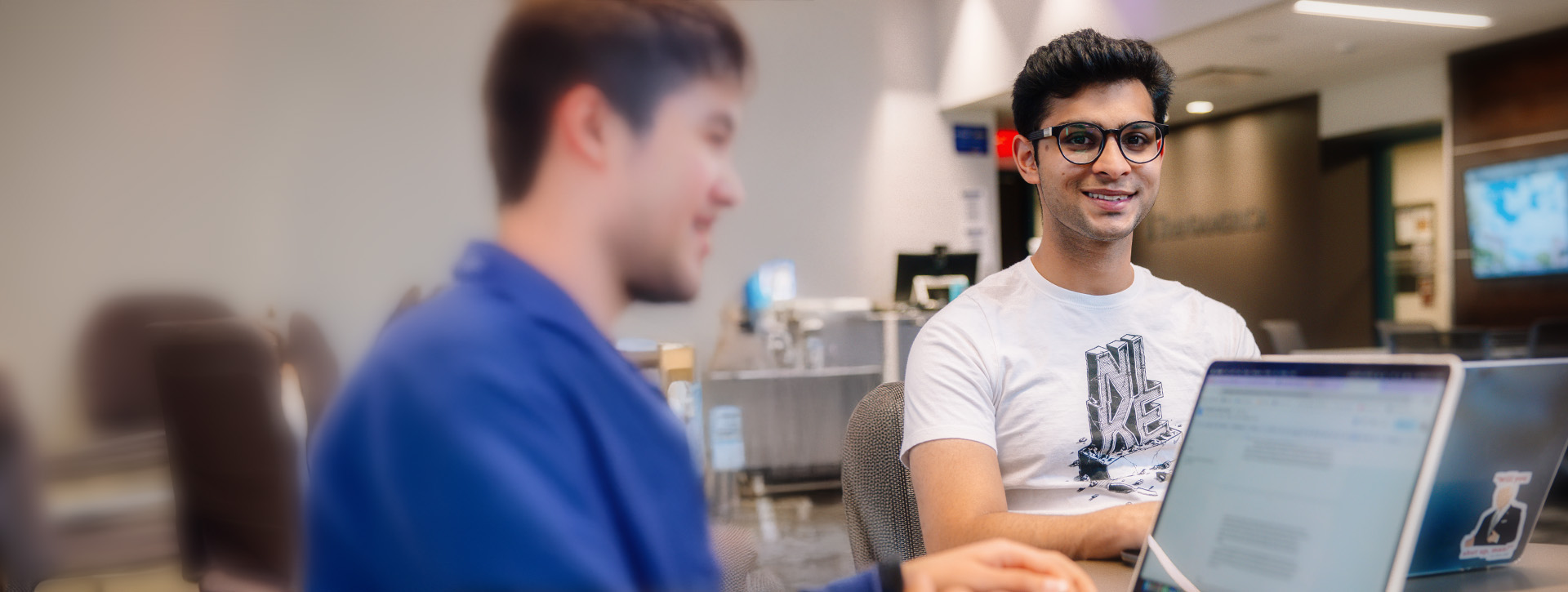 International business student studying STEM subjects on a computer.