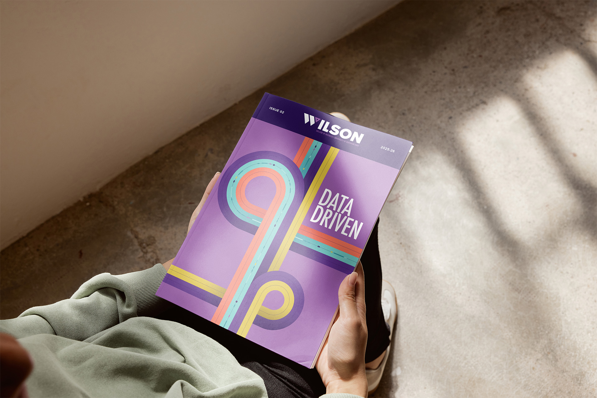 Person holding Wilson Magazine 