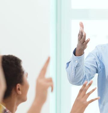 Business teacher in classroom.